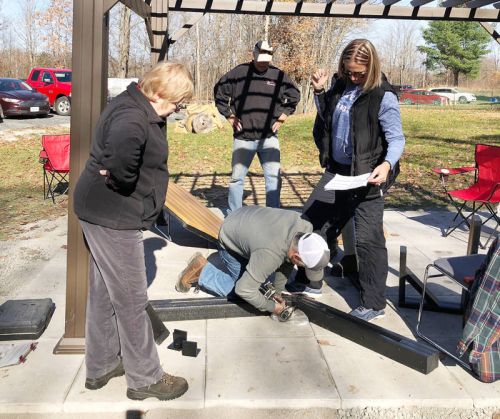 On Saturday October 29 volunteers assembled a new pergola and an accessible picnic table for the seniors at Central Frontenac Housing Corporation on Clement Rd. The new seating area and some additional landscaping was made possible by a grant from the Canada Community Revitalization Fund.